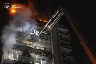Rescue workers put out a fire of a residential building damaged following a Russian strike in Sumy, Ukraine